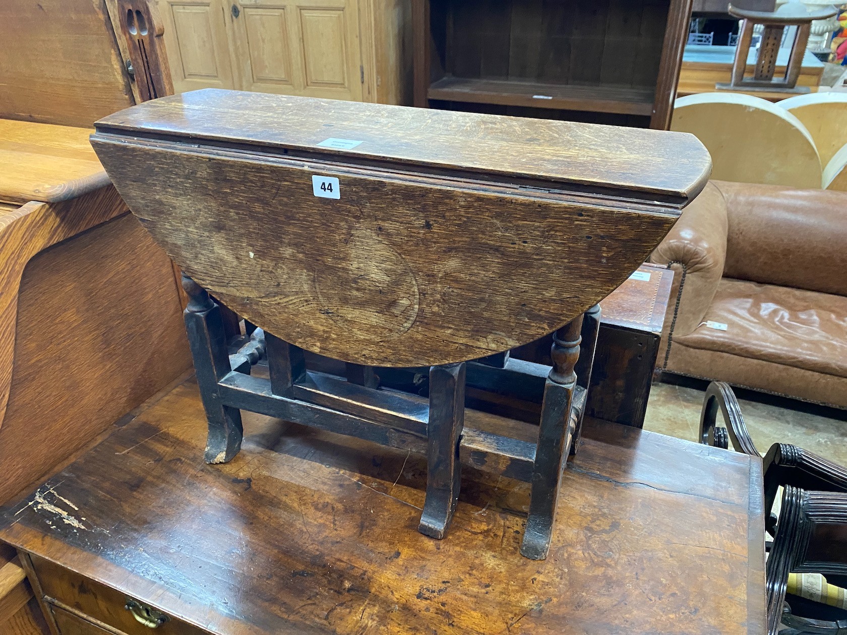 An oak dropflap occasional table, width 70cm, depth 22cm, height 50cm